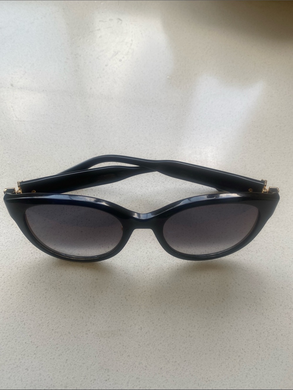 Cartier Black Cat-Eye Sunglasses with Gold Accents and Gradient Lenses